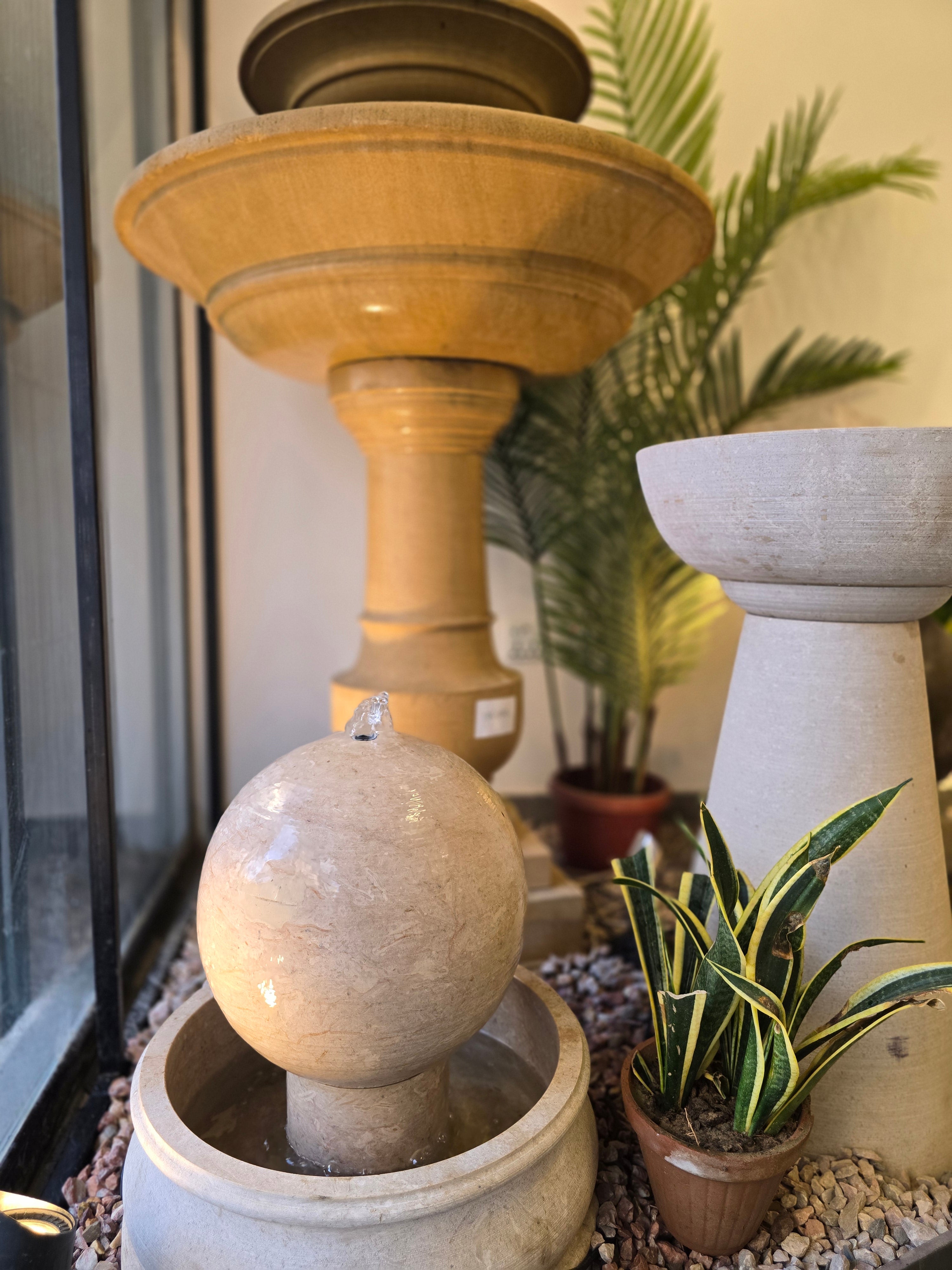 Bowl and orb stone fountains