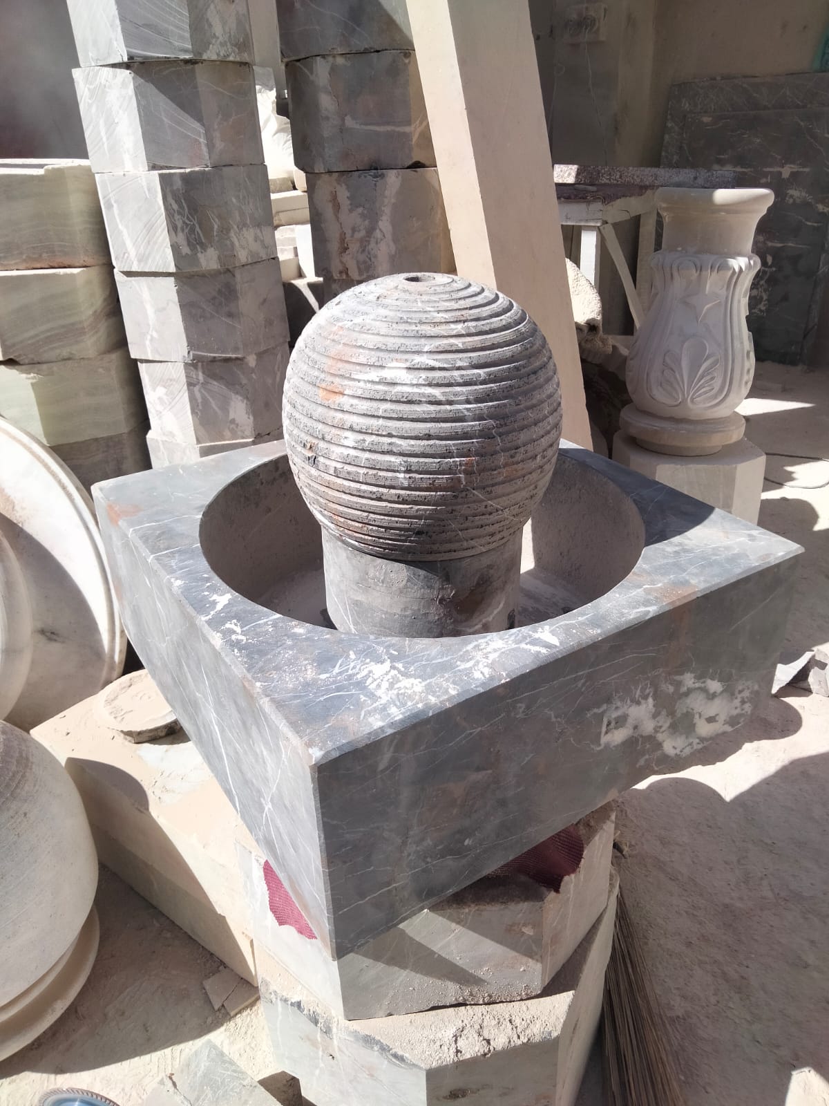 Bowl and orb stone fountains